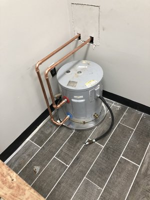 Electric water heater with copper plumbing installed by Remarkable Drain Cleaning SVC